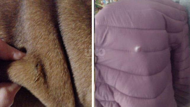 La campera con el impacto y la mascota herida de uno de los vecinos 